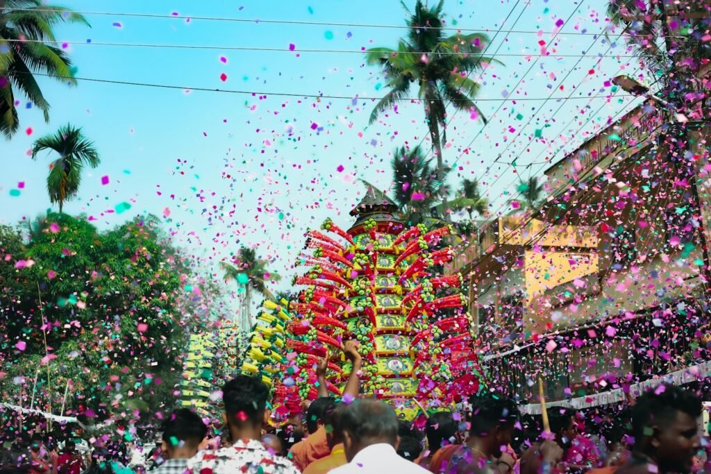 a group of people standing around a street with confetti in the air