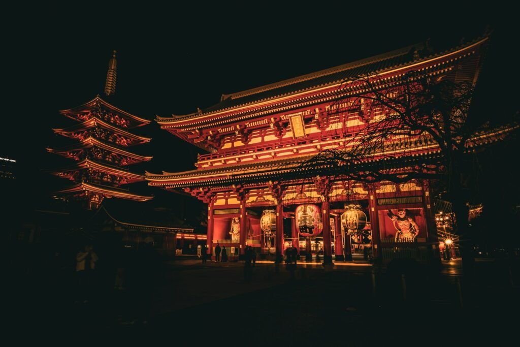 a building lit up at night with lights on it