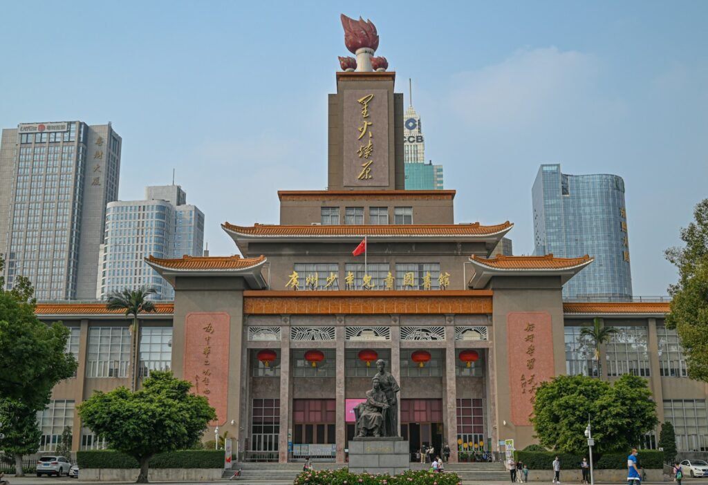 a large building with a statue on top of it