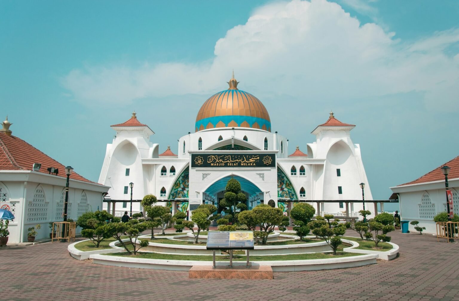 a large white building with a gold domed roof